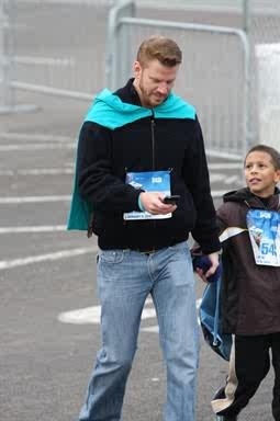 Jaylen and Uncle D approaching the finish line Disney and TSA 5K Run 2010