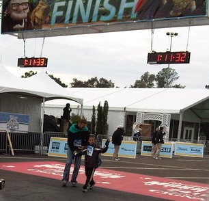 Jaylen and Uncle D at the finish line Disney and TSA 5K Run 2010