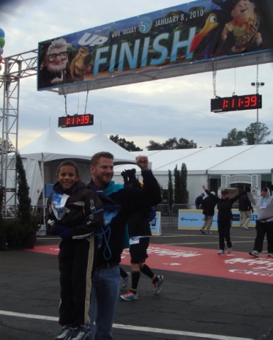 Jaylen and Uncle D at the finish line Disney and TSA 5K Run 2010