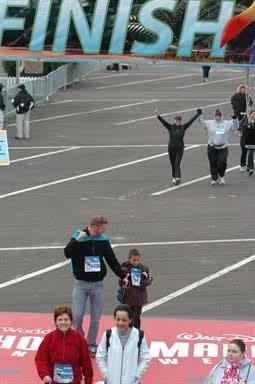 Jaylen and Uncle D at the finish line Disney and TSA 5K Run 2010